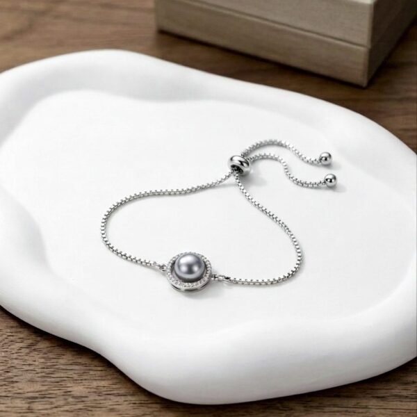 AD Pearl Rakhi Bracelet — silver tone bracelet by Priyavi Creation