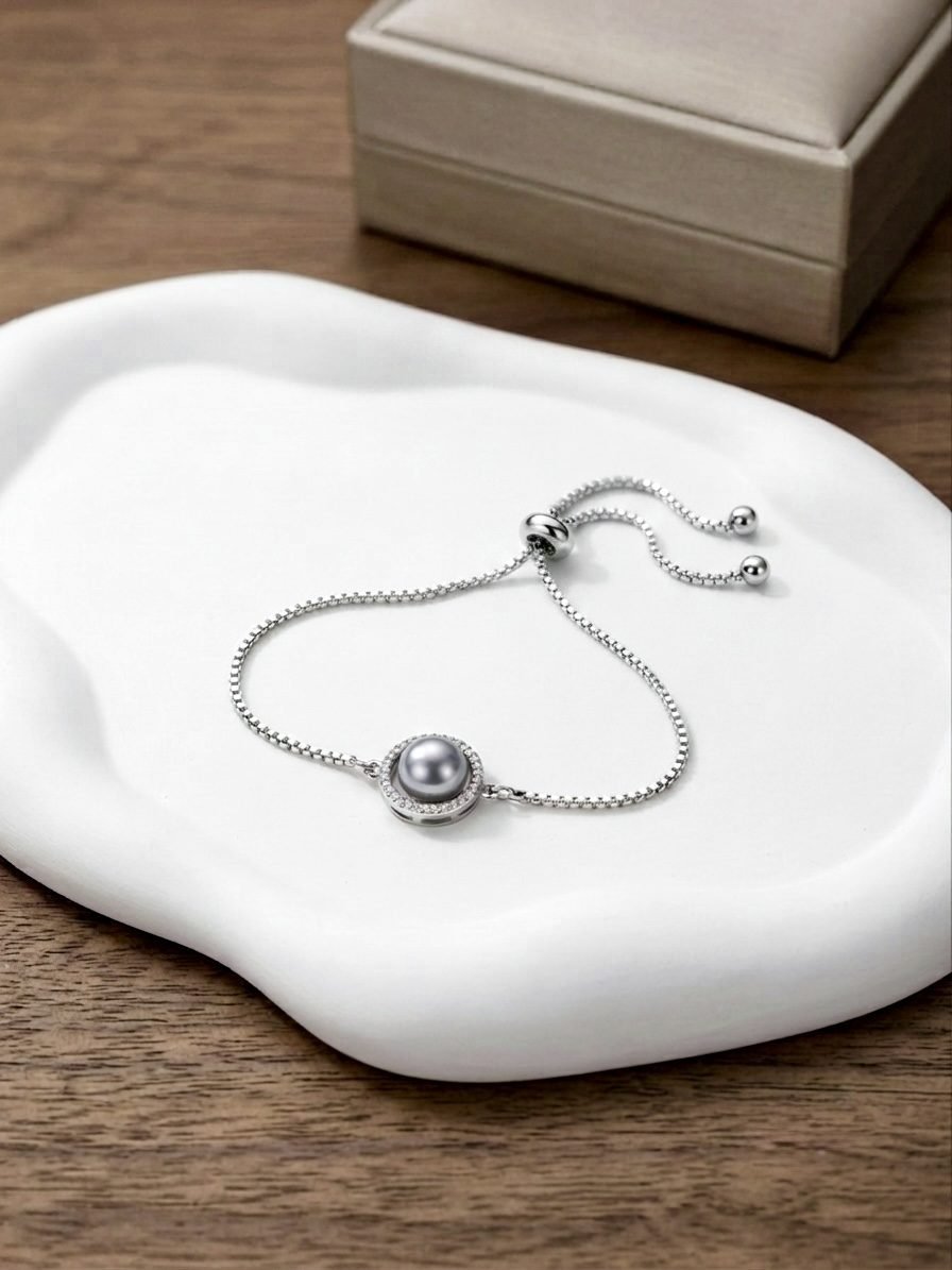 AD Pearl Rakhi Bracelet — silver tone bracelet by Priyavi Creation