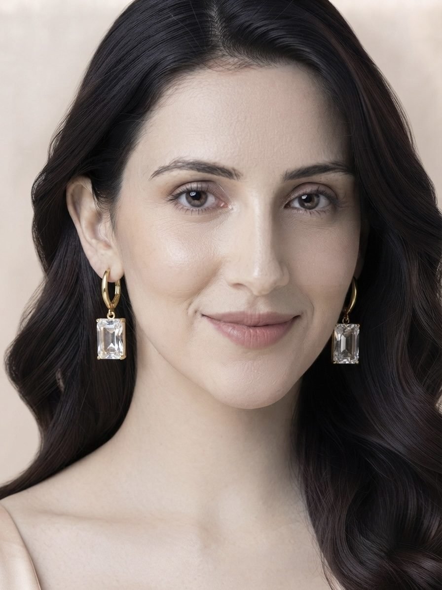 Emerald Cut Crystal Huggie Drop Earrings worn by a model