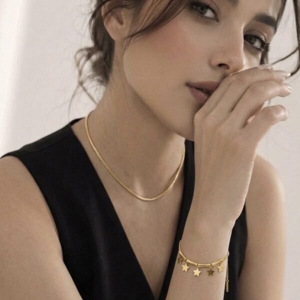 Gold Bamboo Star Bracelet worn by a model