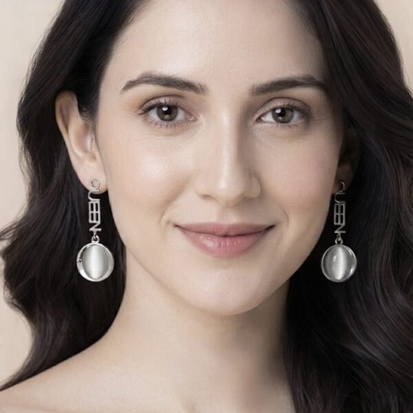 Silver QUEEN Cat Eye Drop Earrings worn by a model