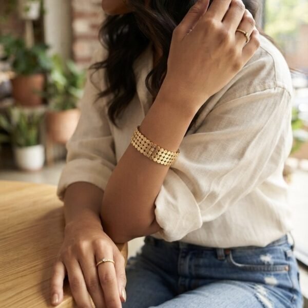 Textured Sequin Wide Bangle worn by a model