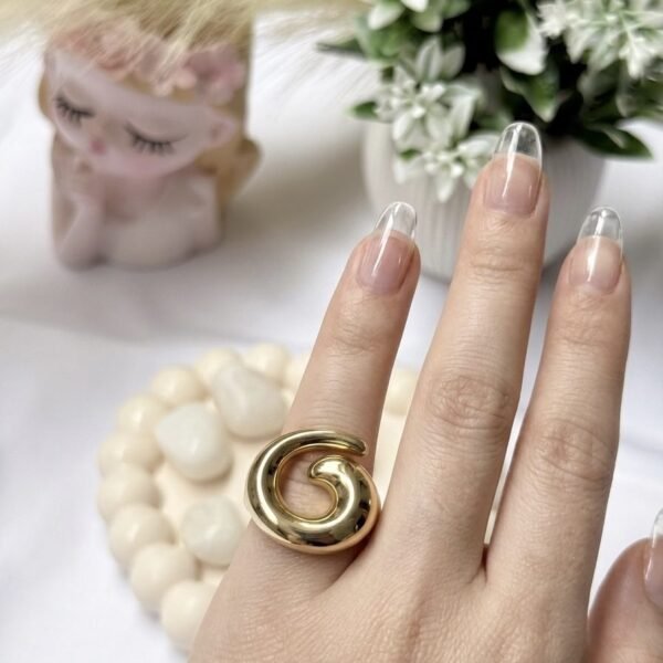 Top Swirl Ring worn by a model